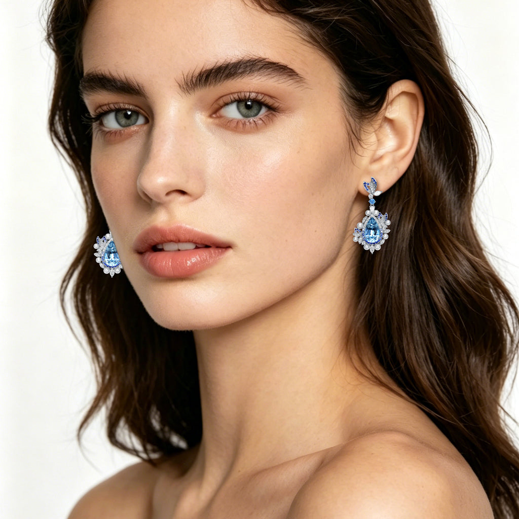 Model wearing TASA 14.33ct aquamarine blue sapphire diamond pearl drop earrings in 18K white gold, luxury fine jewellery editorial portrait