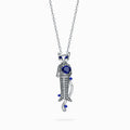 TASA 18K white gold cat pendant necklace featuring 0.82ct natural blue sapphire with 108 black diamond pavé and sapphire accents, front view on white background