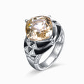 TASA 18K white gold ring featuring 8.01ct cushion-cut champagne-cognac tourmaline with black enamel geometric triangular band and 38 diamonds, side view white background