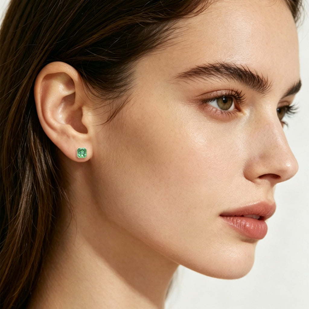 Model wearing TASA mint green asscher-cut tourmaline stud earring in 18K gold bezel setting, fine jewellery lifestyle portrait