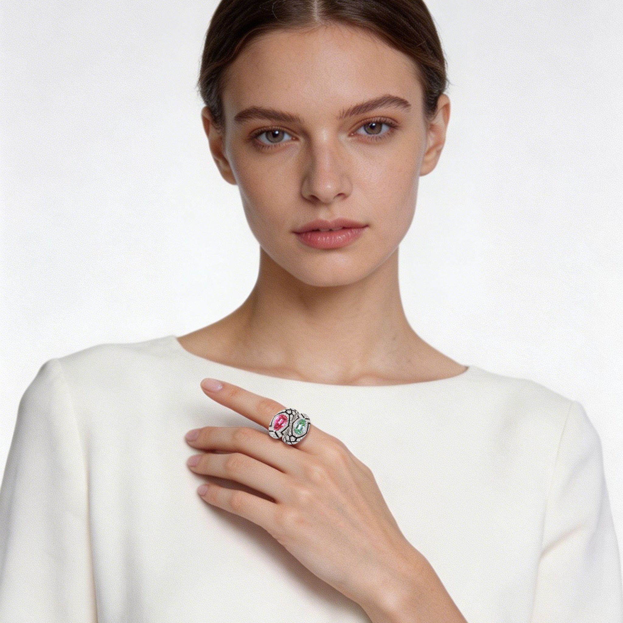 Model wearing TASA certified pink and green tourmaline bypass diamond ring with black enamel geometric band, luxury fine jewellery editorial portrait