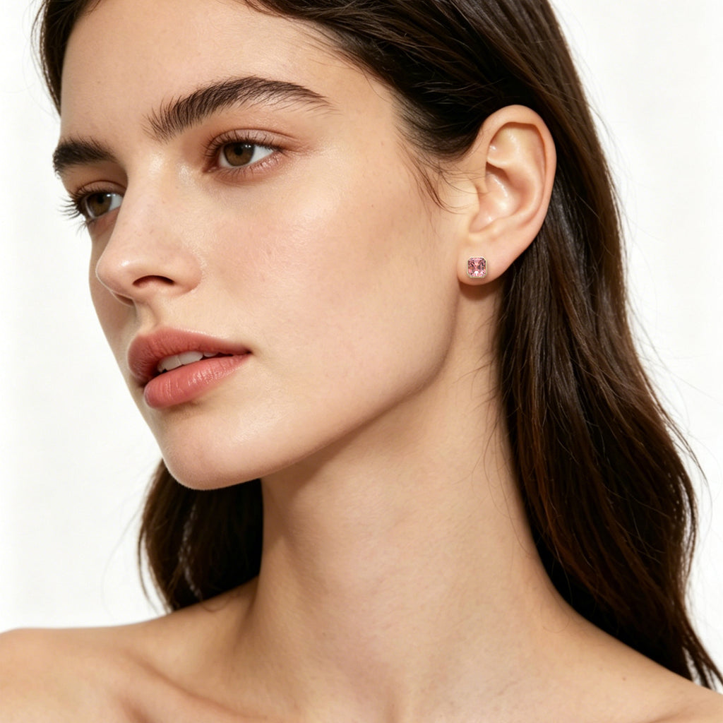 Model wearing TASA blush pink asscher-cut tourmaline stud earring in 18K gold bezel setting, luxury fine jewellery editorial